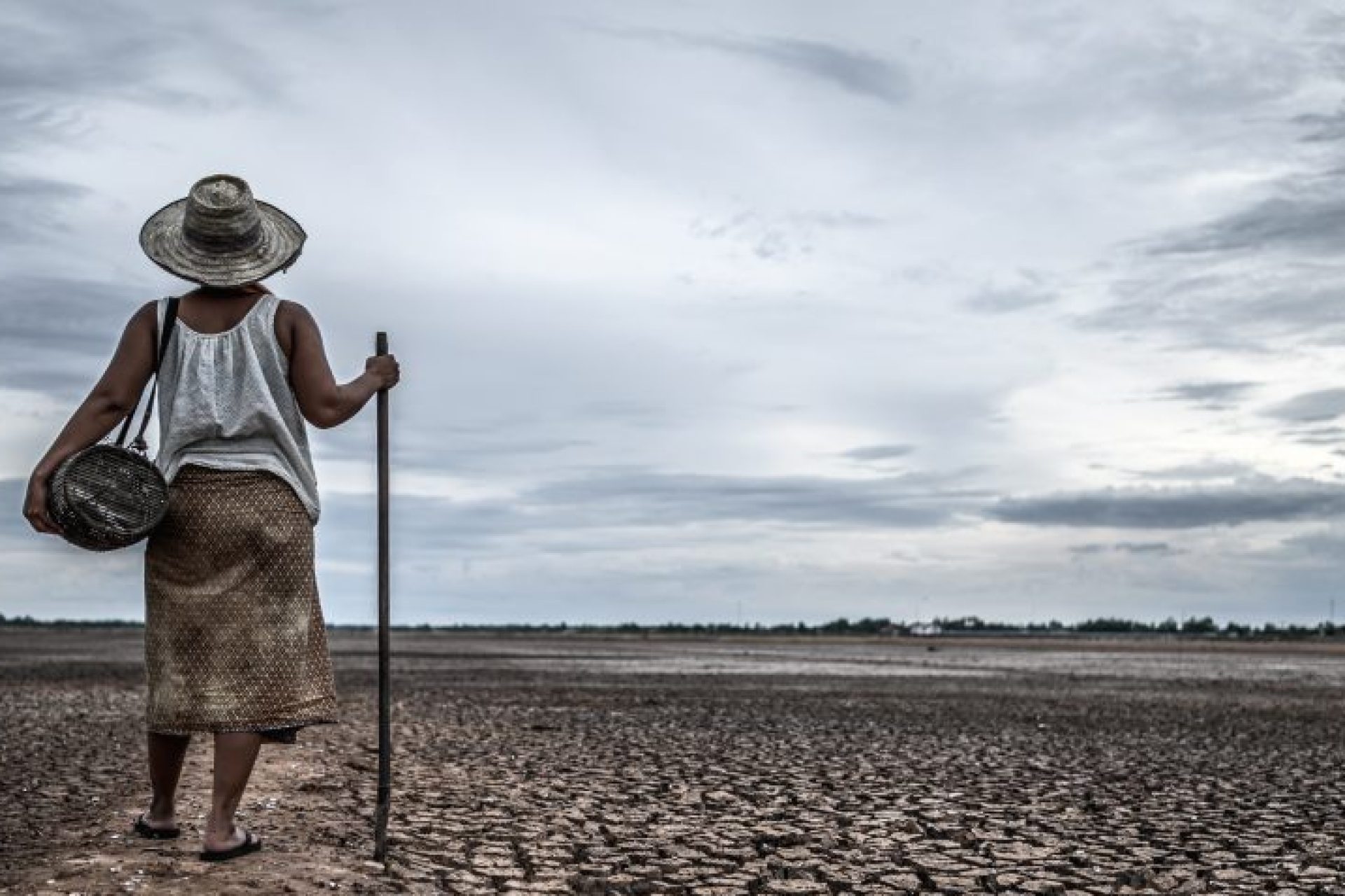 women-standing-on-dry-soil-and-fishing-gear-globa-2023-11-27-05-20-14-utc